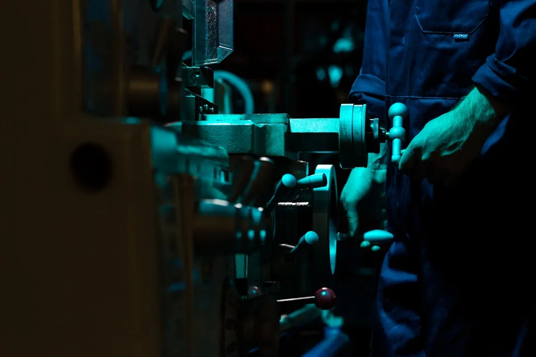 Engineer reviewing technical plans on an industrial site
