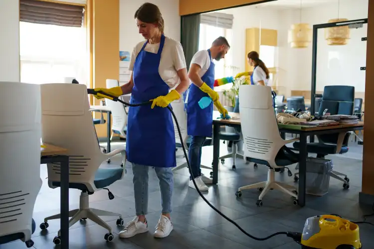 Facility management professional cleaning a commercial office